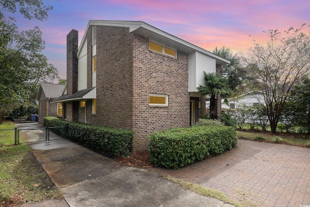 view of property exterior at dusk