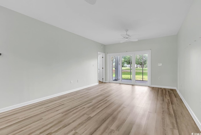 unfurnished room featuring ceiling fan and light hardwood / wood-style floors