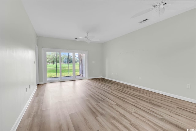 spare room featuring light hardwood / wood-style floors and ceiling fan