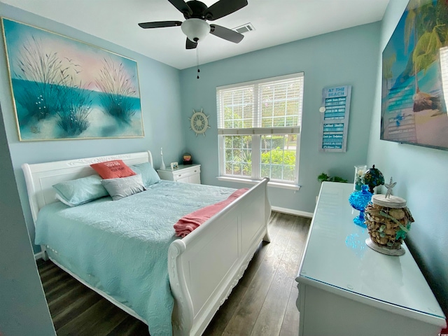 bedroom featuring ceiling fan and dark wood-type flooring