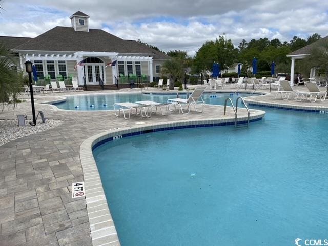 view of swimming pool featuring a patio