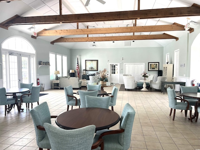 dining area with high vaulted ceiling, beam ceiling, ceiling fan, and light tile patterned flooring