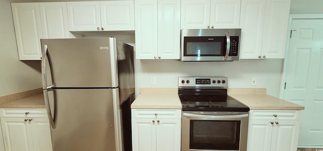 kitchen featuring white cabinets and stainless steel appliances