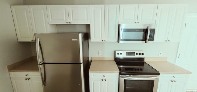 kitchen featuring white cabinets and stainless steel appliances