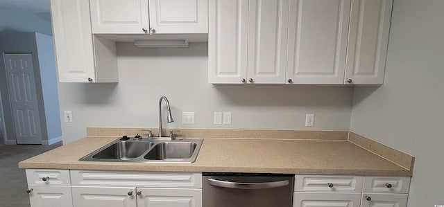 kitchen with sink, white cabinetry, and stainless steel dishwasher