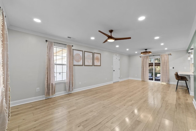 unfurnished living room with ceiling fan, ornamental molding, and light hardwood / wood-style floors