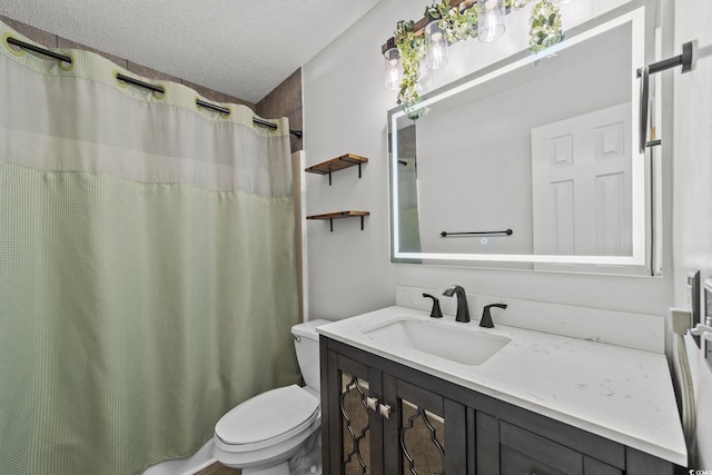 bathroom with a textured ceiling, toilet, a shower with curtain, and vanity