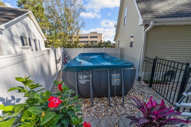 view of yard with a covered pool