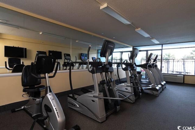 gym featuring a textured ceiling