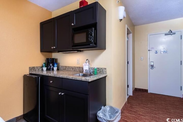 bar featuring sink and black microwave