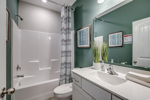 full bathroom with vanity, toilet, and shower / bath combo with shower curtain