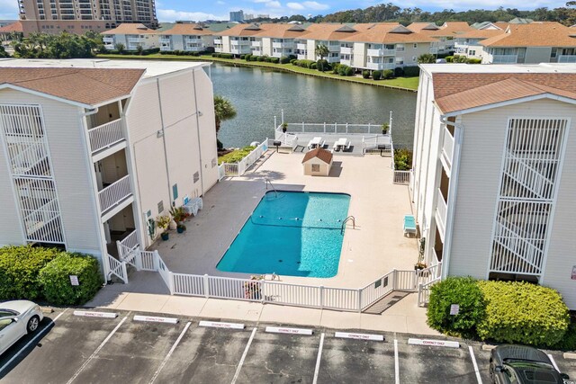1919 Spring St Unit B-31, North Myrtle Beach, SC 29582 - community pool featuring a patio, a water view, and a residential view