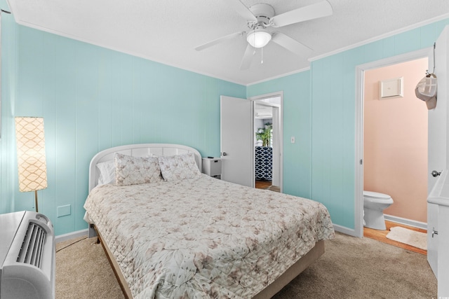 1919 Spring St Unit B-31, North Myrtle Beach, SC 29582 - carpeted bedroom featuring crown molding, ceiling fan, baseboards, and connected bathroom