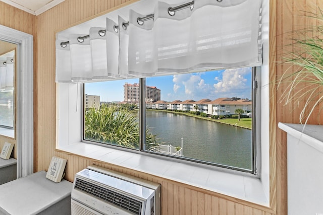 interior space featuring a water view and heating unit