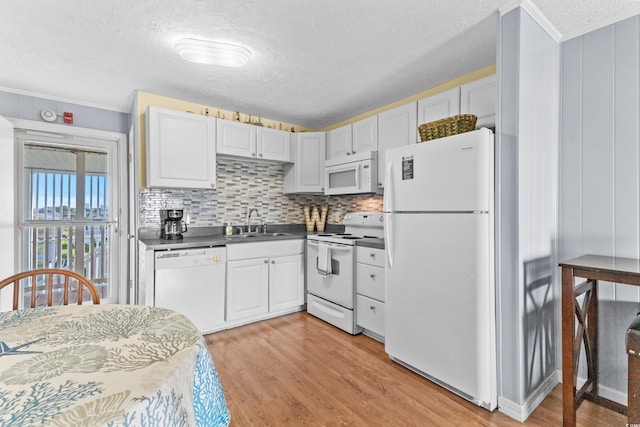 kitchen with light wood-type flooring, white appliances, white cabinetry, and sink