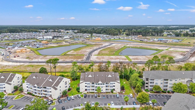 bird's eye view with a water view and a residential view