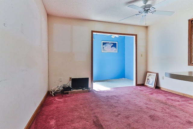 interior space with ceiling fan and carpet flooring