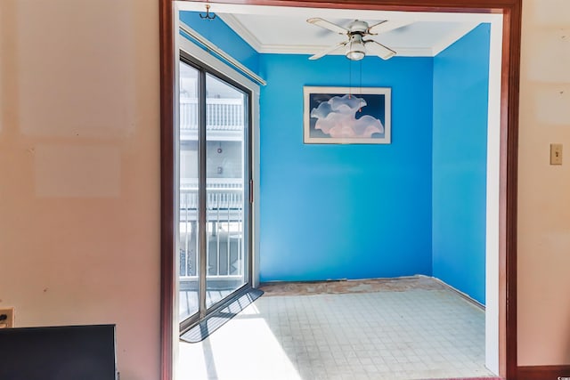 interior space with ceiling fan and crown molding