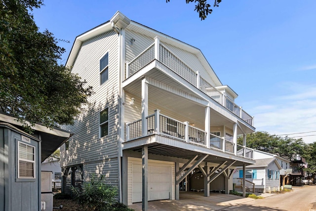 view of front of home with a balcony and a garage