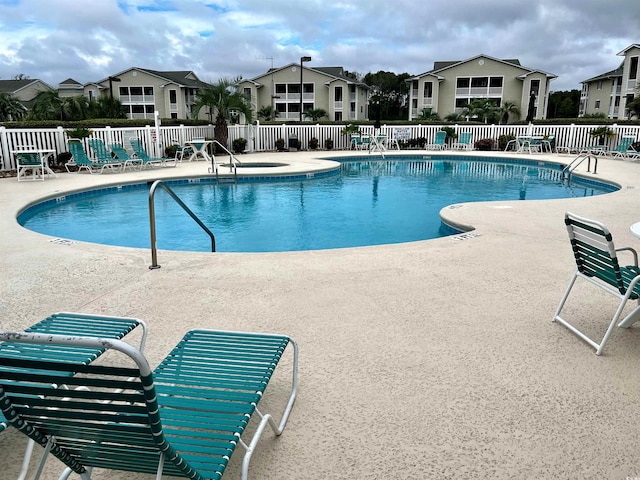 view of pool featuring a patio area