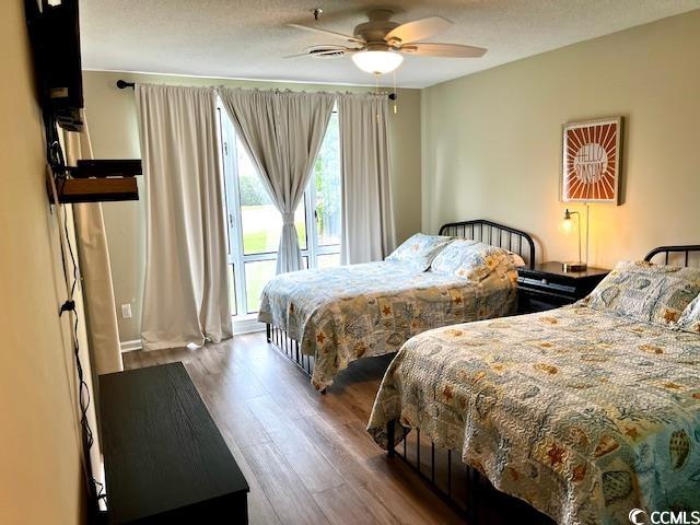 bedroom featuring wood-type flooring and ceiling fan