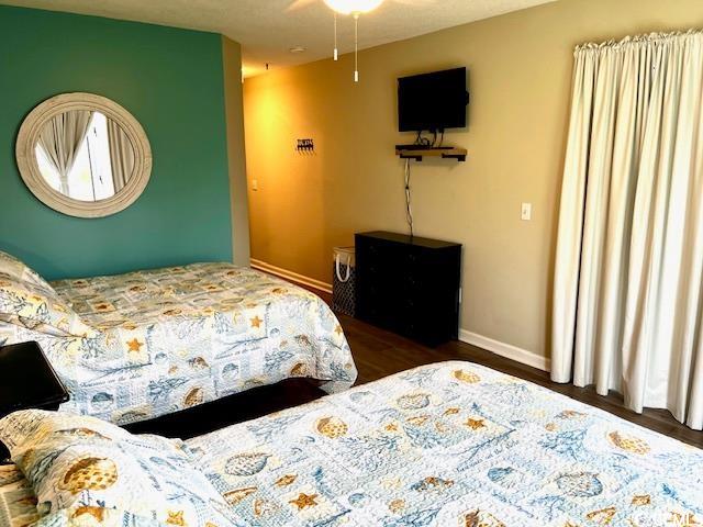 bedroom featuring dark wood-type flooring