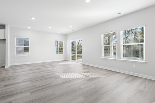 623 Blackthorne Cir NW, Calabash, NC 28467 - unfurnished room featuring light wood-style floors and recessed lighting