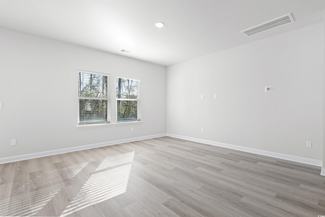 623 Blackthorne Cir NW, Calabash, NC 28467 - unfurnished room with light wood-style flooring and recessed lighting