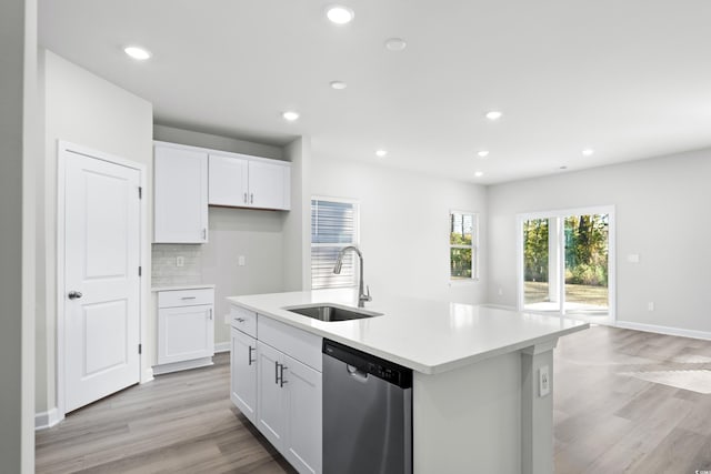 623 Blackthorne Cir NW, Calabash, NC 28467 - kitchen with stainless steel dishwasher, light wood-type flooring, white cabinets, decorative backsplash, and recessed lighting