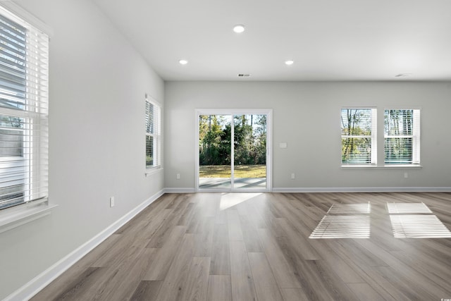 623 Blackthorne Cir NW, Calabash, NC 28467 - spare room featuring wood finished floors and recessed lighting