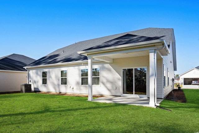 623 Blackthorne Cir NW, Calabash, NC 28467 - rear view of property featuring a patio area, a lawn, and roof with shingles