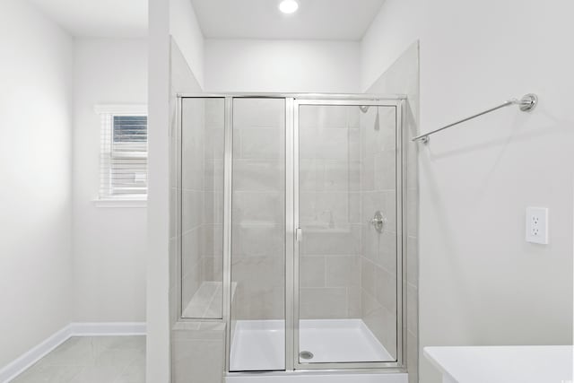 623 Blackthorne Cir NW, Calabash, NC 28467 - full bathroom featuring a stall shower and baseboards
