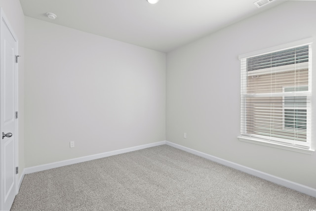 623 Blackthorne Cir NW, Calabash, NC 28467 - carpeted empty room with baseboards and a smoke detector