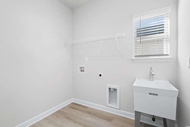623 Blackthorne Cir NW, Calabash, NC 28467 - washroom with light wood-style floors, washer hookup, and electric dryer hookup