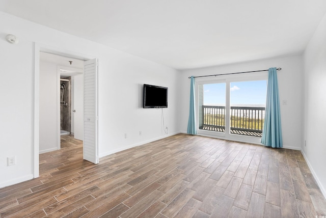 empty room featuring hardwood / wood-style flooring