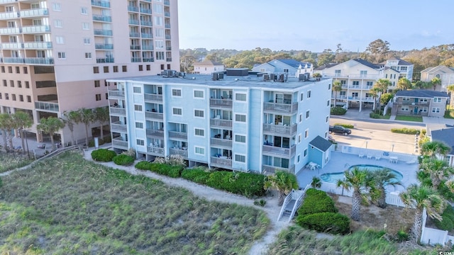 view of property featuring a community pool