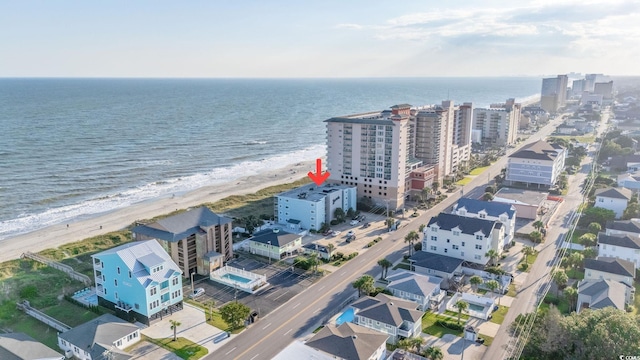 birds eye view of property featuring a view of the beach and a water view