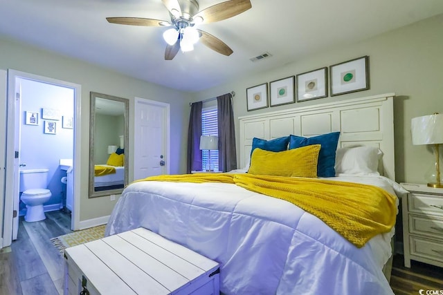 bedroom featuring hardwood / wood-style floors, ceiling fan, and ensuite bathroom