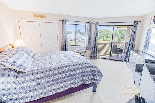 bedroom with light carpet, a closet, multiple windows, and access to outside