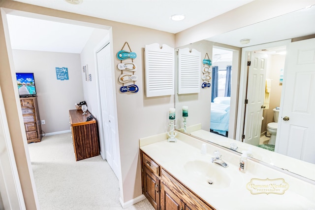 bathroom with vanity and toilet