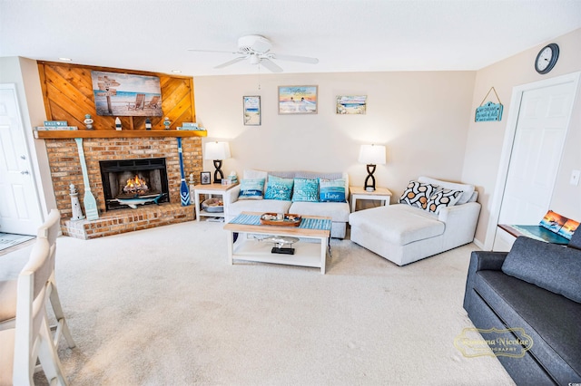 carpeted living room featuring a fireplace, wood walls, and ceiling fan