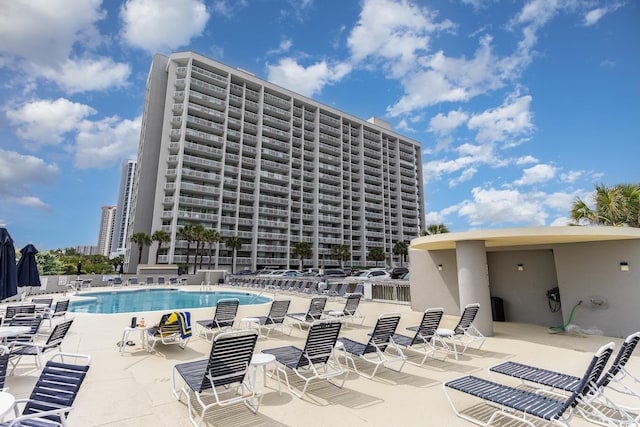 view of swimming pool with a patio