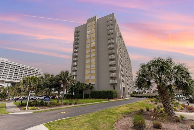 view of outdoor building at dusk