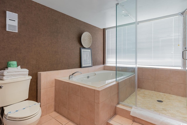 bathroom featuring separate shower and tub, tile patterned flooring, and toilet