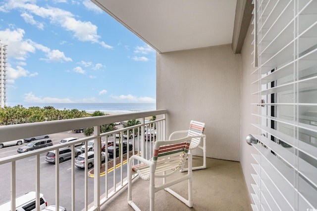 balcony featuring a water view