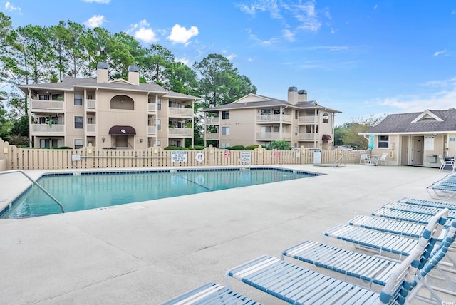 view of swimming pool featuring a patio area