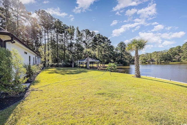 view of yard featuring a gazebo and a water view