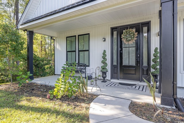 doorway to property featuring a porch