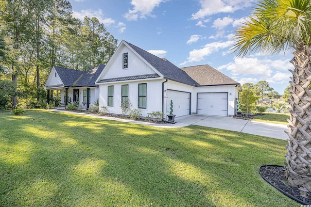 view of front of home with a front yard and a garage