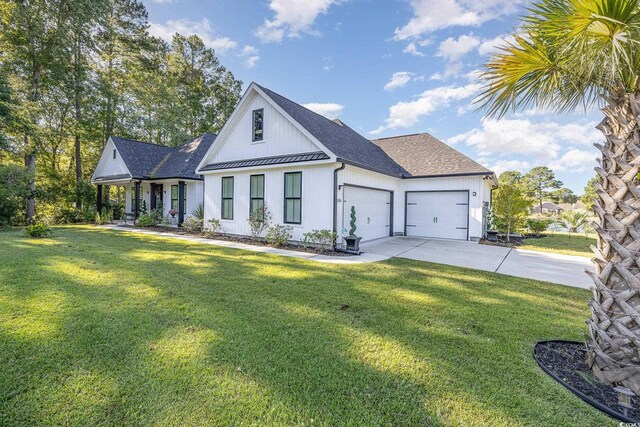 1886 Southwood Dr, Myrtle Beach, SC 29575 - modern inspired farmhouse featuring concrete driveway, a garage, a standing seam roof, and a front yard